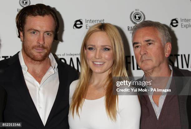 Cast members Toby Stephens, Caity Lotz and Denis Lawson arriving for the UK premiere of The Machine, as part of the 21st Raindance Film Festival, at...