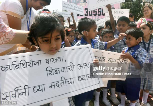 Hearing impaired children up to age of 6 years participate in a rally organised by Cochlea Pune and Swaranaad- a pre-school for Young Born Deaf...