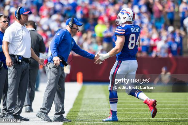 Head coach Sean McDermott of the Buffalo Bills shakes the hand of Nick O'Leary as he leaves the field during the game against the New York Jets on...