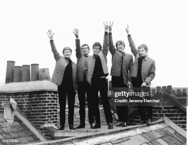 Photo of MANFRED MANN; L-R: Mike Vickers, Tom McGuinness, Manfred Mann, Paul Jones, Mike Hugg - posed, group shot, on rooftops, holding up fingers...