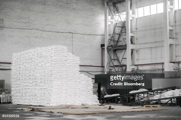 Workers load bags of refined white sugar onto an elevator at the ED&F Man Ltd. Refinery in Nikolaev, Ukraine, on Friday, Sept. 22, 2017. More...