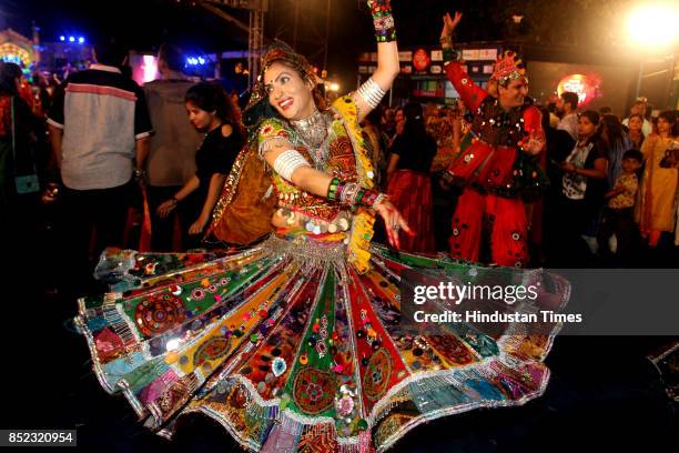 Women perform Dandiya dance at "Thane Raas Rang Navratri Festival" during Navratri festival at Modella Mill Compound, on September 22, 2017 in...