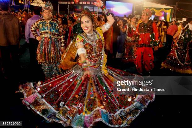 Women perform Dandiya dance at "Thane Raas Rang Navratri Festival" during Navratri festival at Modella Mill Compound, on September 22, 2017 in...