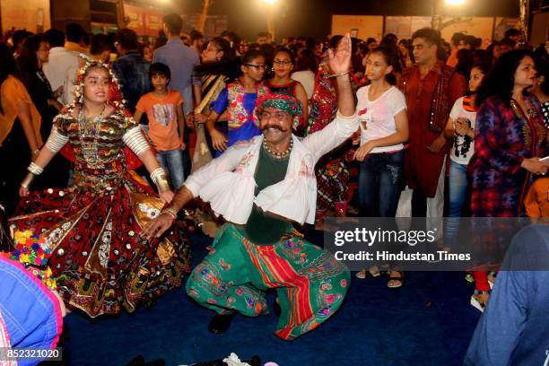 Women perform Dandiya dance at "Thane Raas Rang Navratri Festival" during Navratri festival at Modella Mill Compound, on September 22, 2017 in...