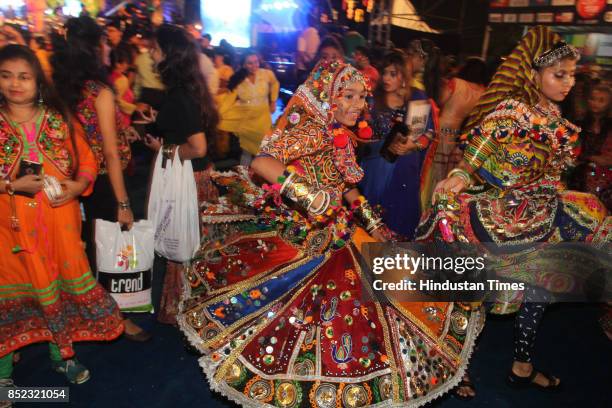 Women perform Dandiya dance at "Thane Raas Rang Navratri Festival" during Navratri festival at Modella Mill Compound, on September 22, 2017 in...