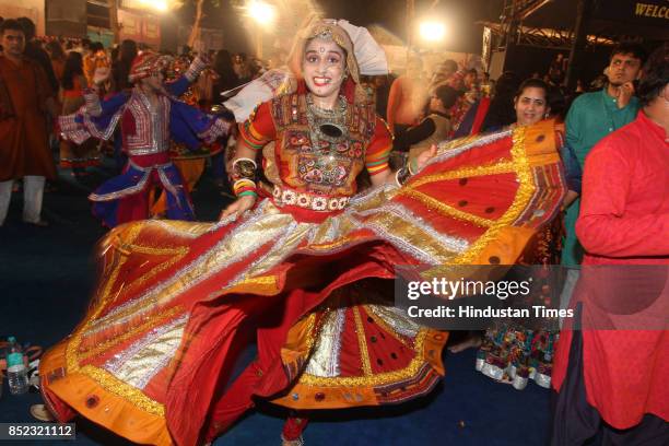 Women perform Dandiya dance at "Thane Raas Rang Navratri Festival" during Navratri festival at Modella Mill Compound, on September 22, 2017 in...