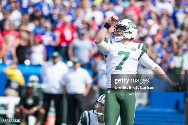 Chandler Catanzaro and Lac Edwards of the New York Jets watches a field goal attempt go through the uprights during the game against the Buffalo...