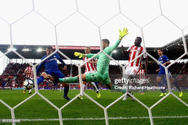 Alvaro Morata of Chelsea scores his sides fourth goal past Jack Butland of Stoke City during the Premier League match between Stoke City and Chelsea...