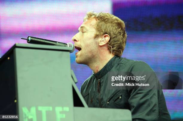 Photo of LIVE 8 and Chris MARTIN and COLDPLAY, Chris Martin - performing live onstage at Live 8, with Make Trade Fair logo on piano