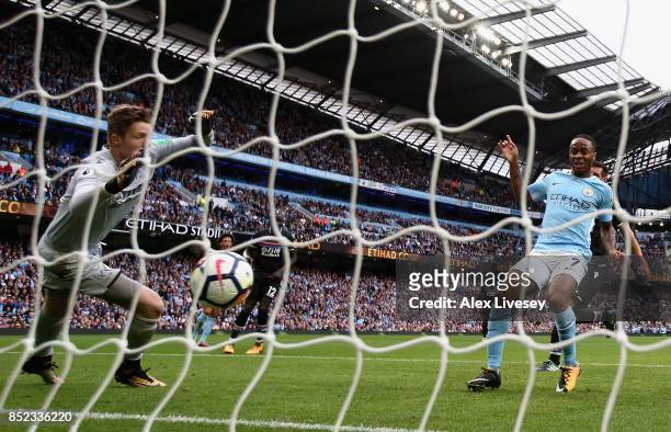Raheem Sterling of Manchester City scores his sides third goal past Wayne Hennessey of Crystal Palace during the Premier League match between...