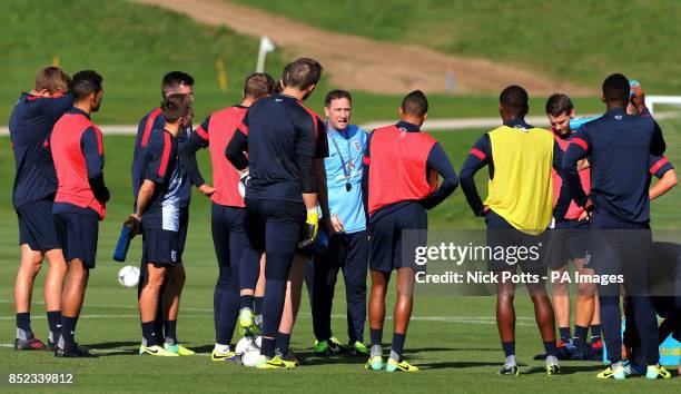 England's U21 coach Steve Holland speaks to the players during a training session at St George's Park, Burton.