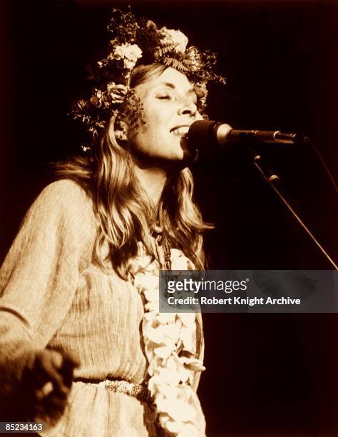 Canadian-American singer-songwriter Joni Mitchell performing on stage, 1974.