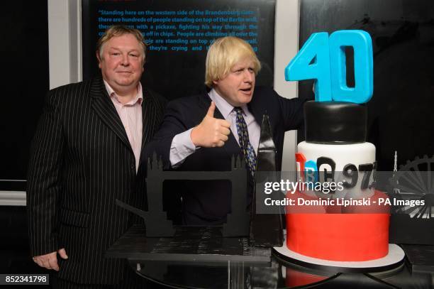 Nick Ferrari and Mayor of London Boris Johnson cut a birthday cake at the LBC 97.3 40th birthday party, at Millbank Tower, in Westminster, central...