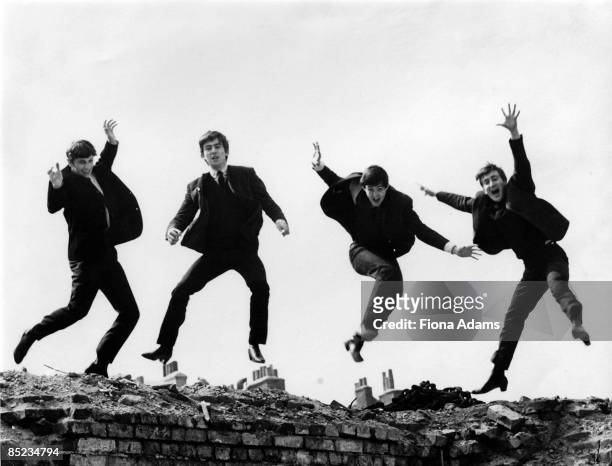 Photo of the Beatles, April 1963; L-R: Ringo Starr, George Harrison, Paul McCartney, John Lennon - posed, group shot - jumping on wall, Used on the...