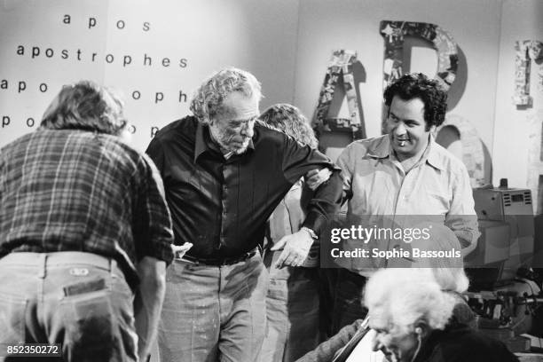 American poet, novelist and short story writer Charles Bukowski, drinking on the set of the French TV program Apostrophes hosted by Bernard Pivot.