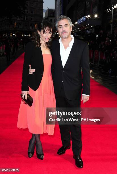 Director Alfonso Cuaron with guest arriving at the 57th BFI London Film Festival official screening of Gravity at The Odeon, Leicester Square, London.