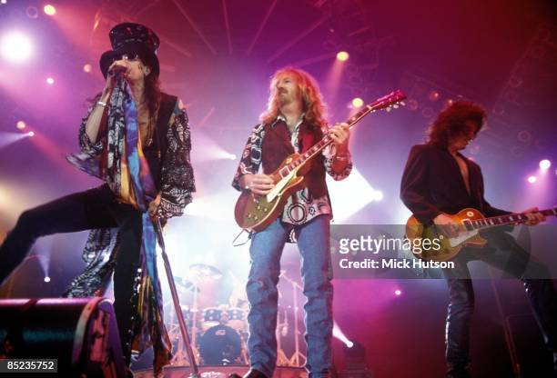 Photo of Brad WHITFORD and Steven TYLER and Joe PERRY and AEROSMITH, L-R. Steven Tyler, Brad Whitford, Joe Perry performing live onstage