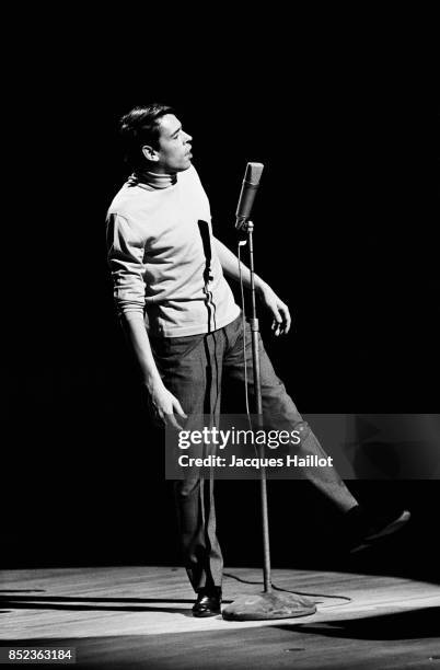 Belgian singer Jacques Brel on stage at the ORTF Theatre.