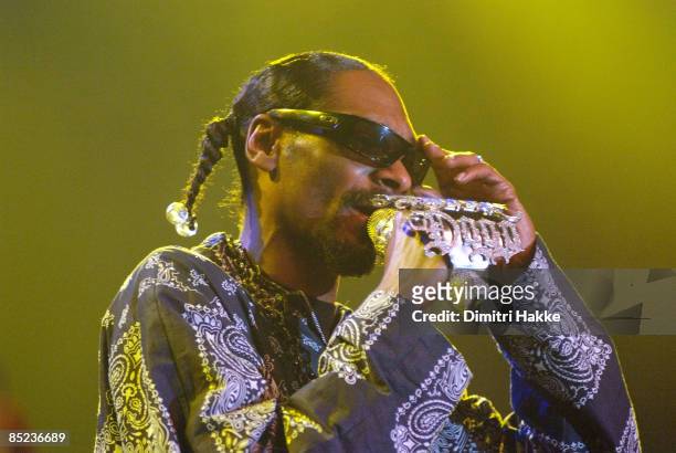 Photo of SNOOP DOGG, performing live onstage, with jewelled microphone