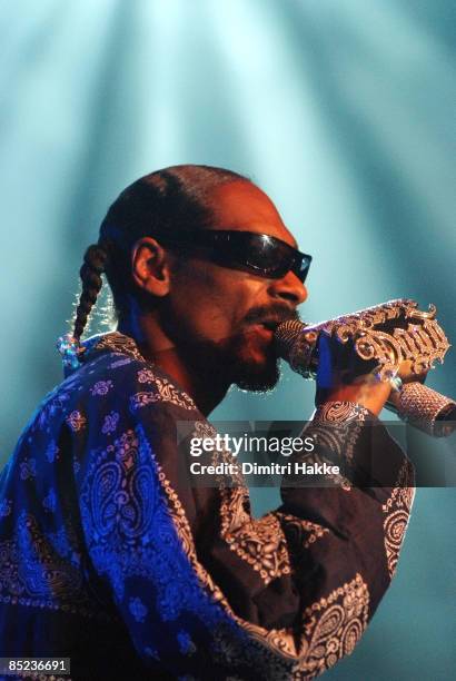 Photo of SNOOP DOGG, performing live onstage, with jewelled microphone