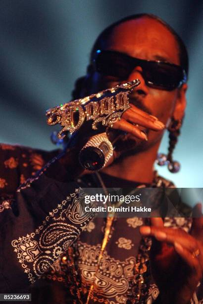 Photo of SNOOP DOGG, performing live onstage, with jewelled microphone