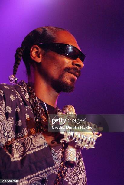 Photo of SNOOP DOGG, performing live onstage, with jewelled microphone