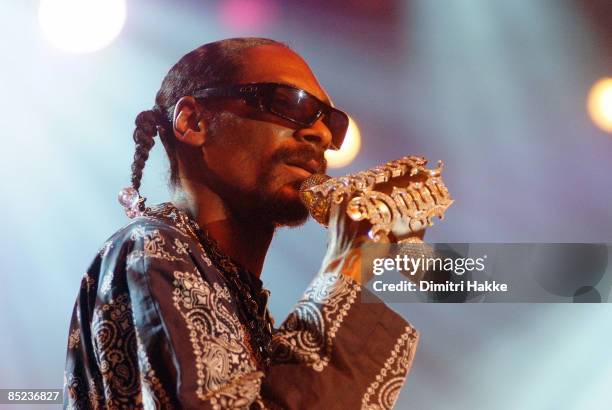 Photo of SNOOP DOGG, performing live onstage, with jewelled microphone