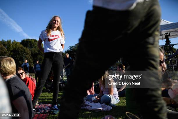 Labour Party supporter poses for a photo ahead of a speech by party leader Jeremy Corbyn at a Momentum rally on September 23, 2017 in Brighton,...