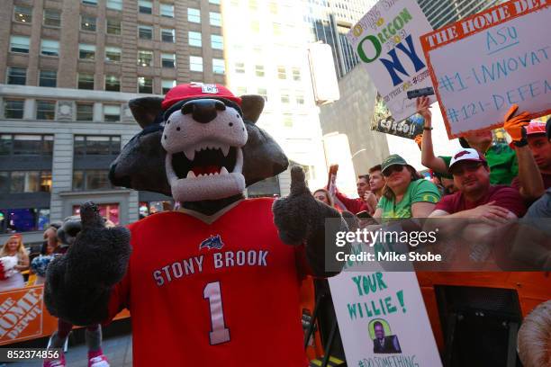 Fans are seen during ESPN's College GameDay show at Times Square on September 23, 2017 in New York City.