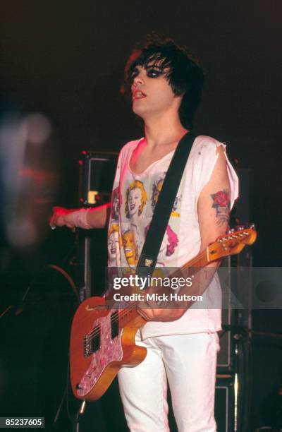 Photo of Richey EDWARDS and MANIC STREET PREACHERS, Richey Edwards performing live onstage, playing Fender Telecaster Thinline guitar, showing tattoo...