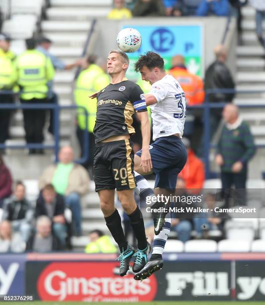 Preston North End's Josh Earl jumps with Millwall's Steve Morison during the Sky Bet Championship match between Preston North End and Millwall at...