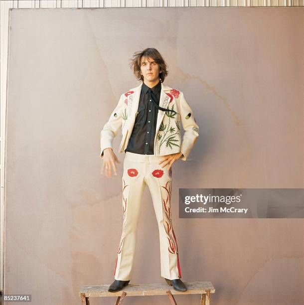 Photo of Gram PARSONS; In front of A&M Records Photo Studio in suit specially made for him by "Nudie, the rodeo tailor"