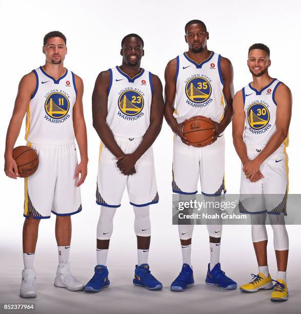 Klay Thompson, Draymond Green, Kevin Durant and Stephen Curry of the Golden State Warriors pose for a portrait during media day on September 22, 2017...
