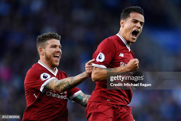 Philippe Coutinho of Liverpool celebrates scoring his sides second goal with Alberto Moreno during the Premier League match between Leicester City...