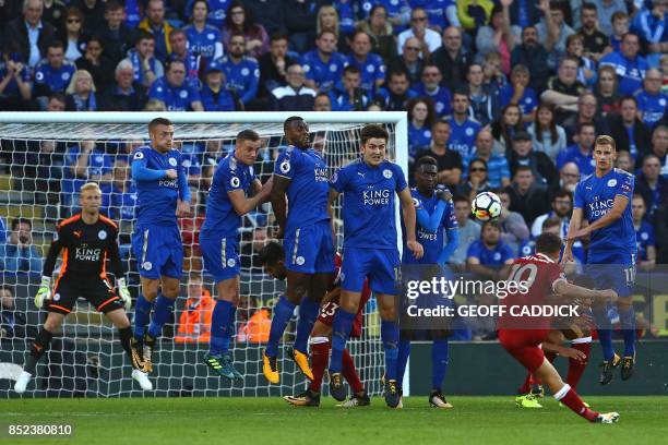 Liverpool's Brazilian midfielder Philippe Coutinho scores their second goal with this freekick during the English Premier League football match...