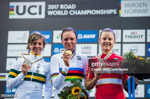 Gold medalist Netherlands' Chantal Blaak , silver medalist Australia's Katrin Garfoot and Denmark's Amalie Dideriksen pose with their medals after...