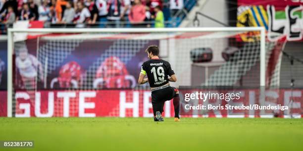 David Angel Abraham of Eintracht Frankfurt sits on the pitch after losing the Bundesliga match between RB Leipzig and Eintracht Frankfurt at Red Bull...