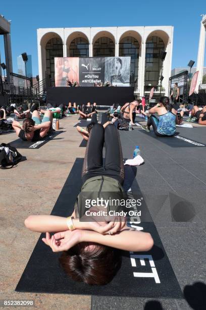 Guests workout at the first ever workout session in Lincoln Center hosted by PUMA & New York City Ballet on September 23, 2017 in New York City.
