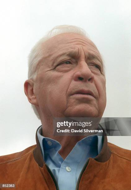 Ariel Sharon, head of Israel's right-wing opposition Likud Party, looks out to the West Bank January 3, 2001 as he visits the Tovlan army outpost...