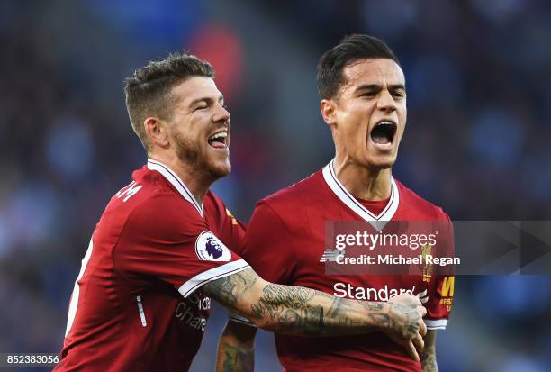 Philippe Coutinho of Liverpool celebrates scoring his sides second goal with Alberto Moreno of Liverpool during the Premier League match between...