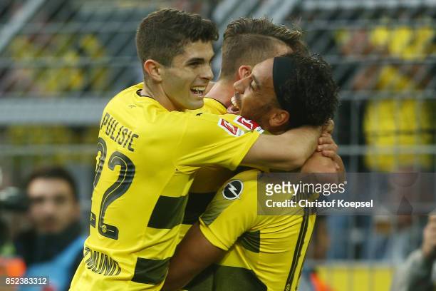 Maximilian Philipp of Dortmund celebrates with Pierre-Emerick Aubameyang of Dortmund and Lukasz Piszczek of Dortmund after he scored his teams first...