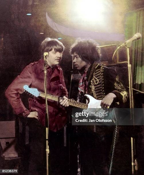 Photo of Chas CHANDLER and Jimi HENDRIX, with manager Chas Chandler, posed during filming of German TV Show 'Beat Club'