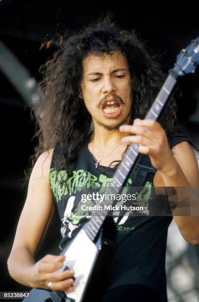 Photo of Kirk HAMMETT and METALLICA, Kirk Hammett performing live onstage, playing Gibson Flying V guitar