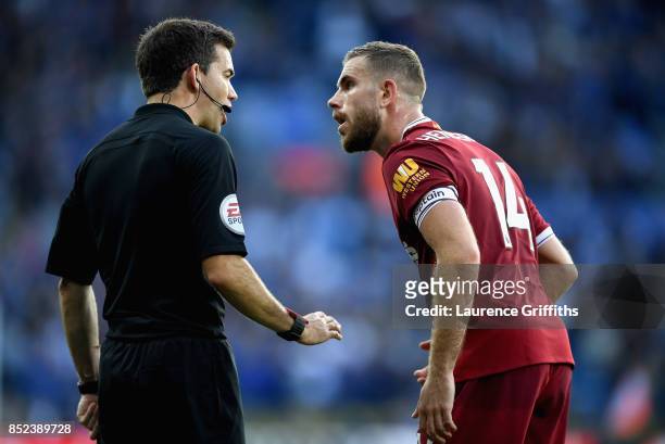 Jordan Henderson of Liverpool complaines to the linesman after Leicester City score their first goal during the Premier League match between...