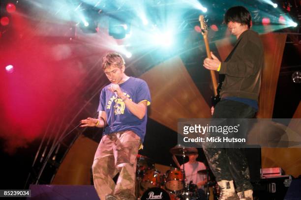 Photo of Alex JAMES and Damon ALBARN and BLUR, Damon Albarn and Alex James performing live onstage