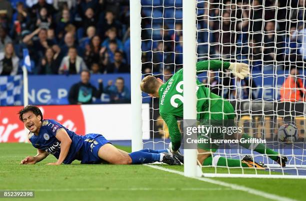 Shinji Okazaki of Leicester City reacts after scoring his sides first goal during the Premier League match between Leicester City and Liverpool at...