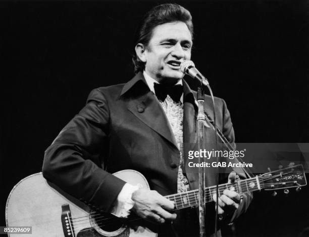 Photo of Johnny CASH; Johnny Cash performing on stage
