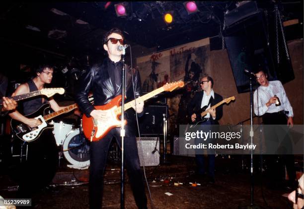 Photo of Elvis COSTELLO, Elvis Costello performs at CBGB. Richard Hell is a far right