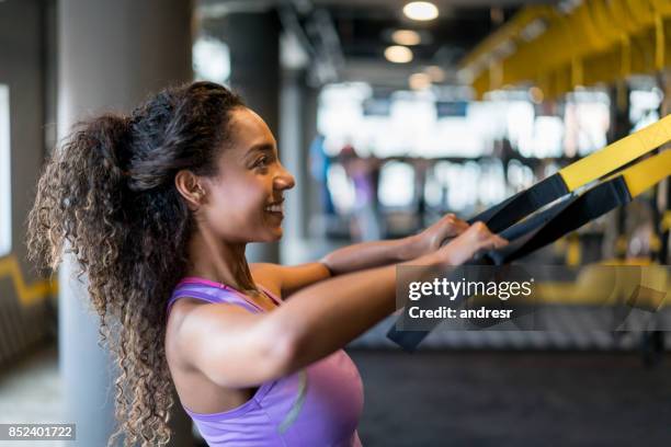 woman suspension training at the gym - suspension training stock pictures, royalty-free photos & images