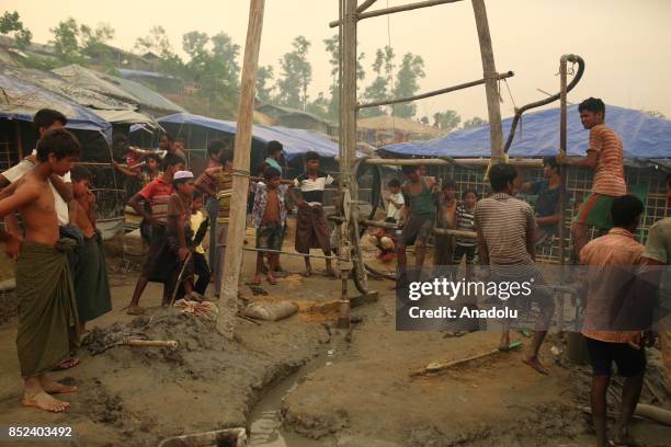 Rohingya Muslims build a makeshift camp in Teknaff, Bangladesh on September 23, 2017. Violence erupted in Myanmars Rakhine state on Aug. 25 when the...